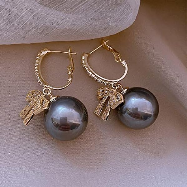 Round Cubic Zirconia Earrings With Bow Design / Ruchi 