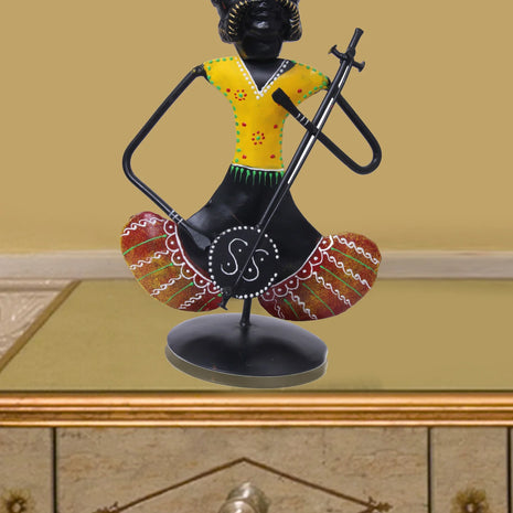 Metallic Doll Playing Musical Instrument / Ruchi
